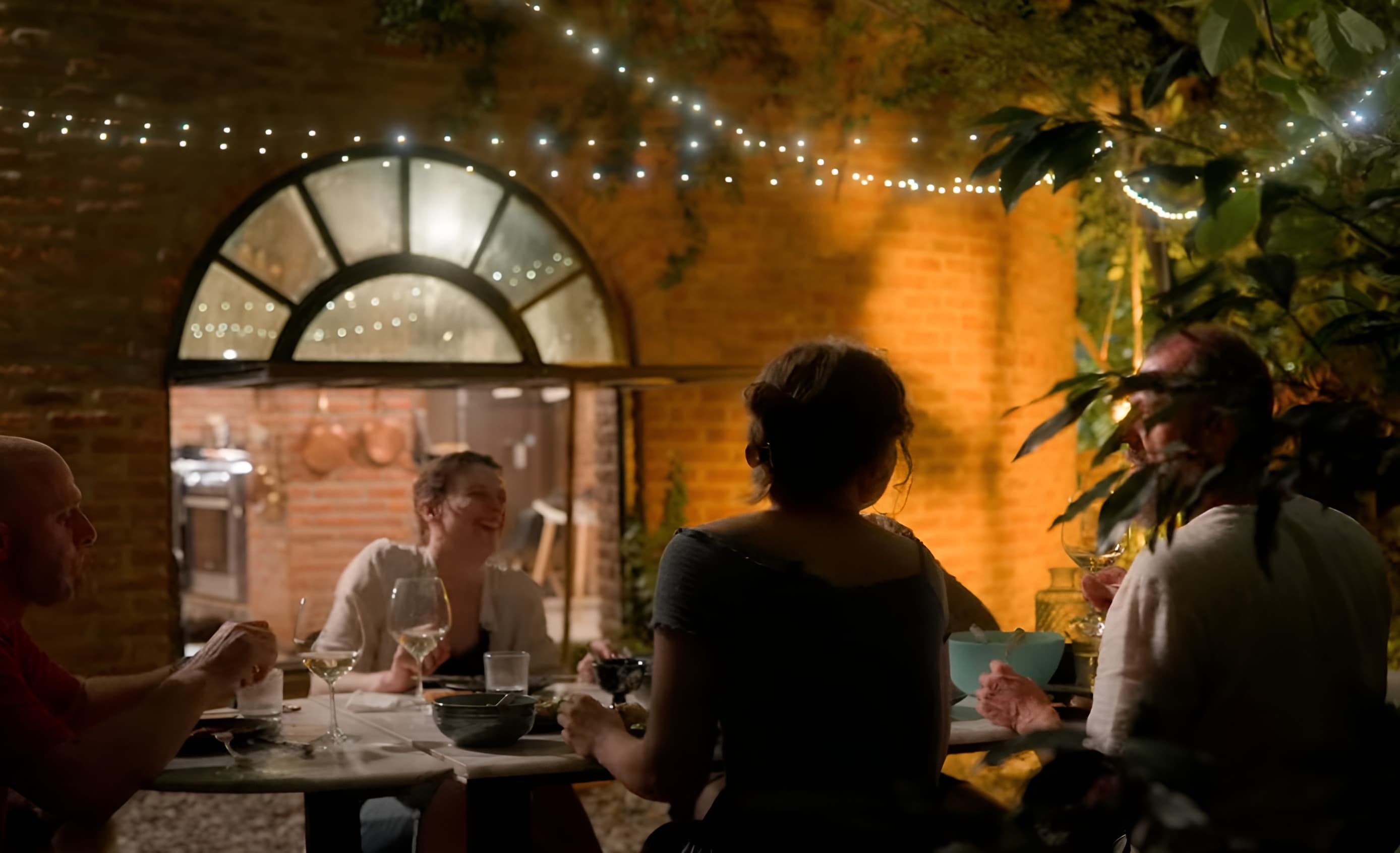 Evening dinner in the garden under the lights